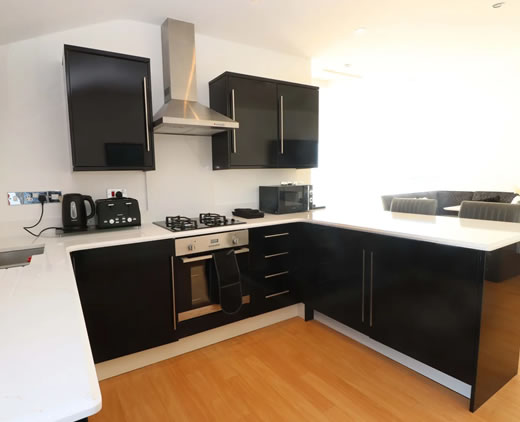 Fully equipped modern kitchen at Sea Breeze Retreat Pwllheli
